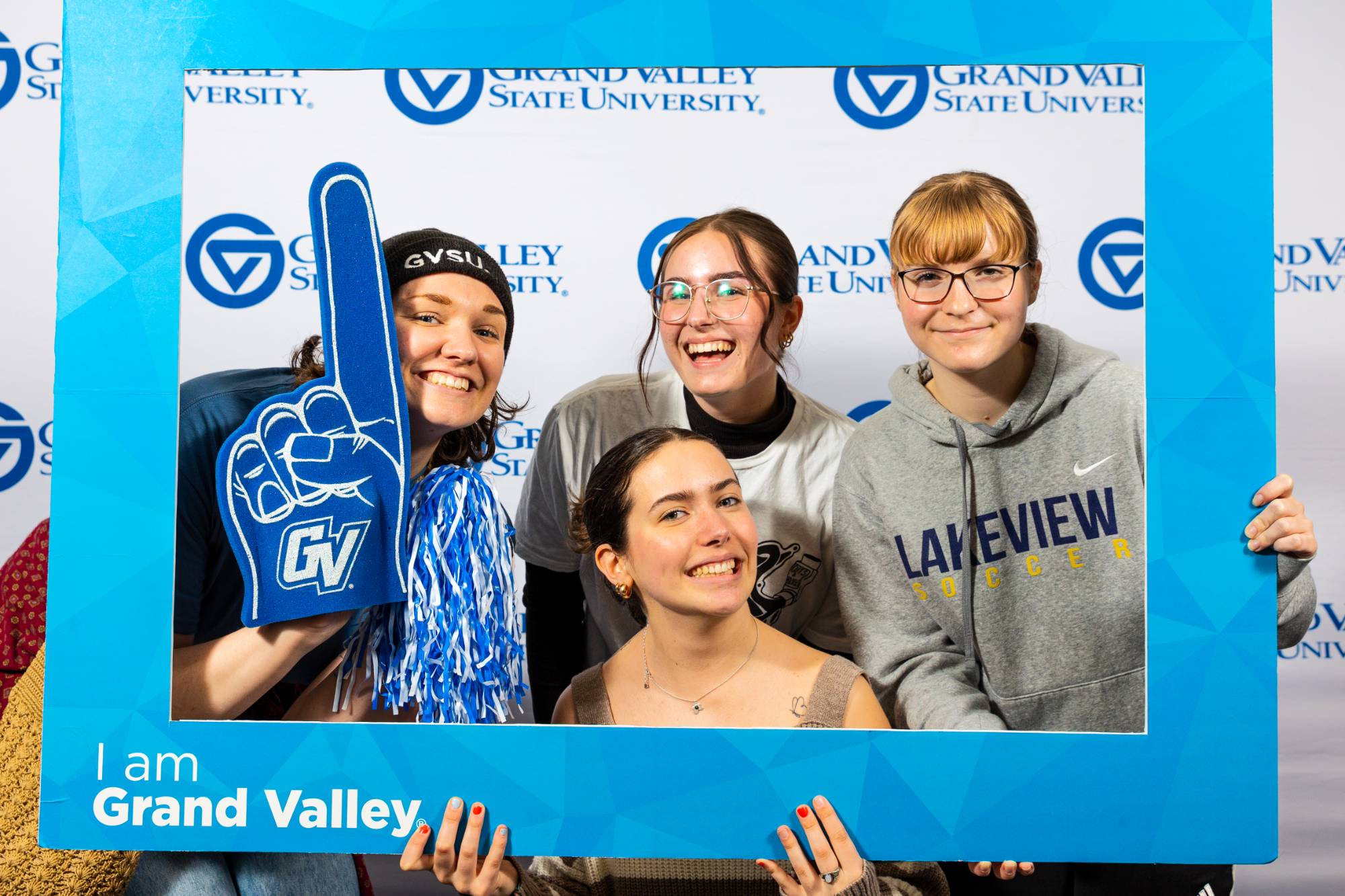 Students holding Grand Valley spirit gear